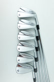 Six TaylorMade golf iron clubs arranged in a fan shape on a clean white background.